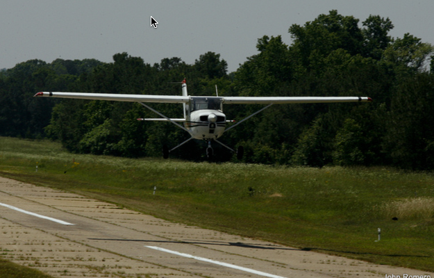 Cessna making a low pass